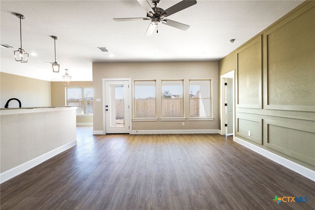 2005 Blackhawk Loop Belton, TX 76513 - Photo 7 of 37 a view of a kitchen with wooden floor and a sink