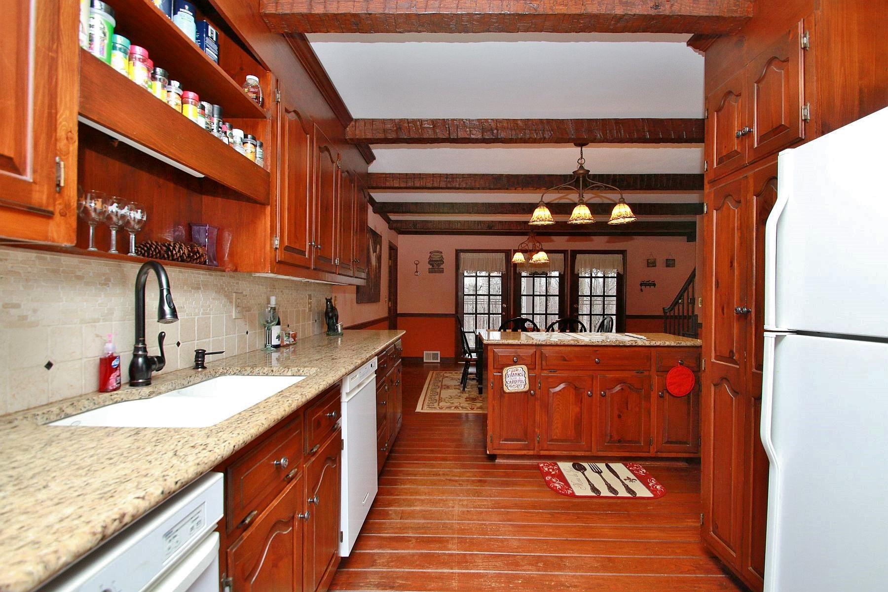 392 Morgans Fork Road Penhook, VA 24137 - Photo 13 of 56 a kitchen with stainless steel appliances granite countertop a refrigerator