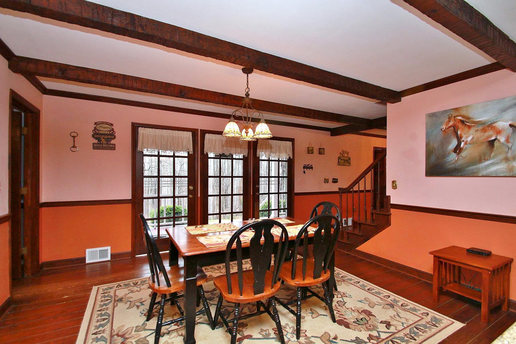 392 Morgans Fork Road Penhook, VA 24137 - Photo 14 of 56 a view of a dining room with furniture a rug and wooden floor