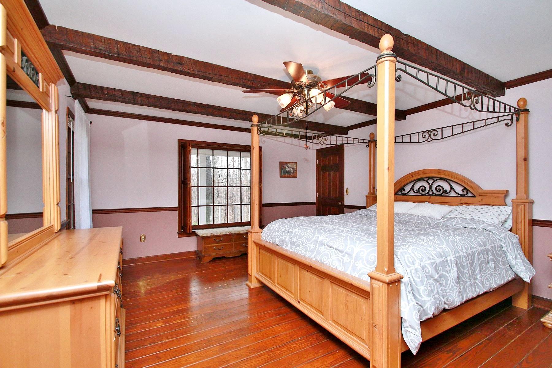 392 Morgans Fork Road Penhook, VA 24137 - Photo 15 of 56 a bed room with a bed and a window