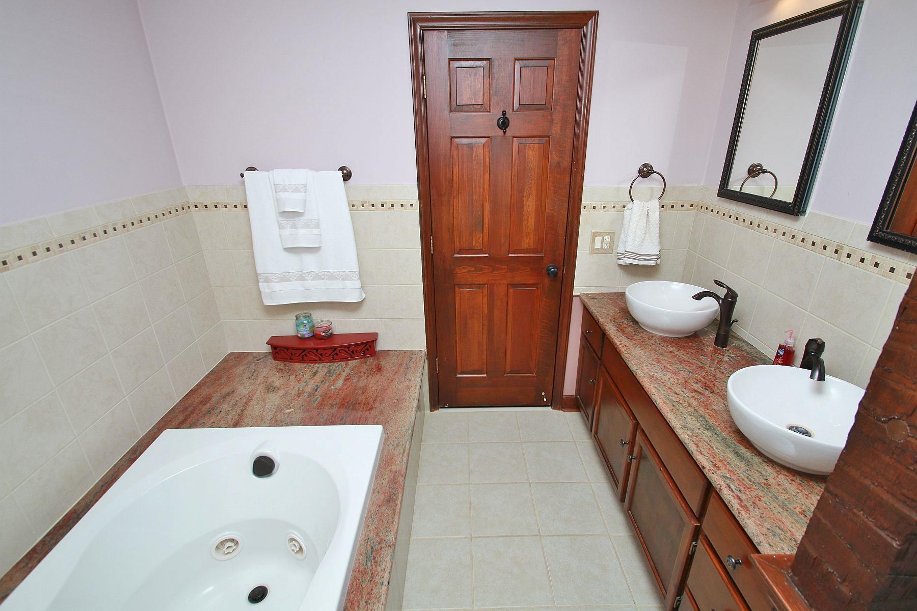 392 Morgans Fork Road Penhook, VA 24137 - Photo 19 of 56 a bathroom with a tub sink and toilet