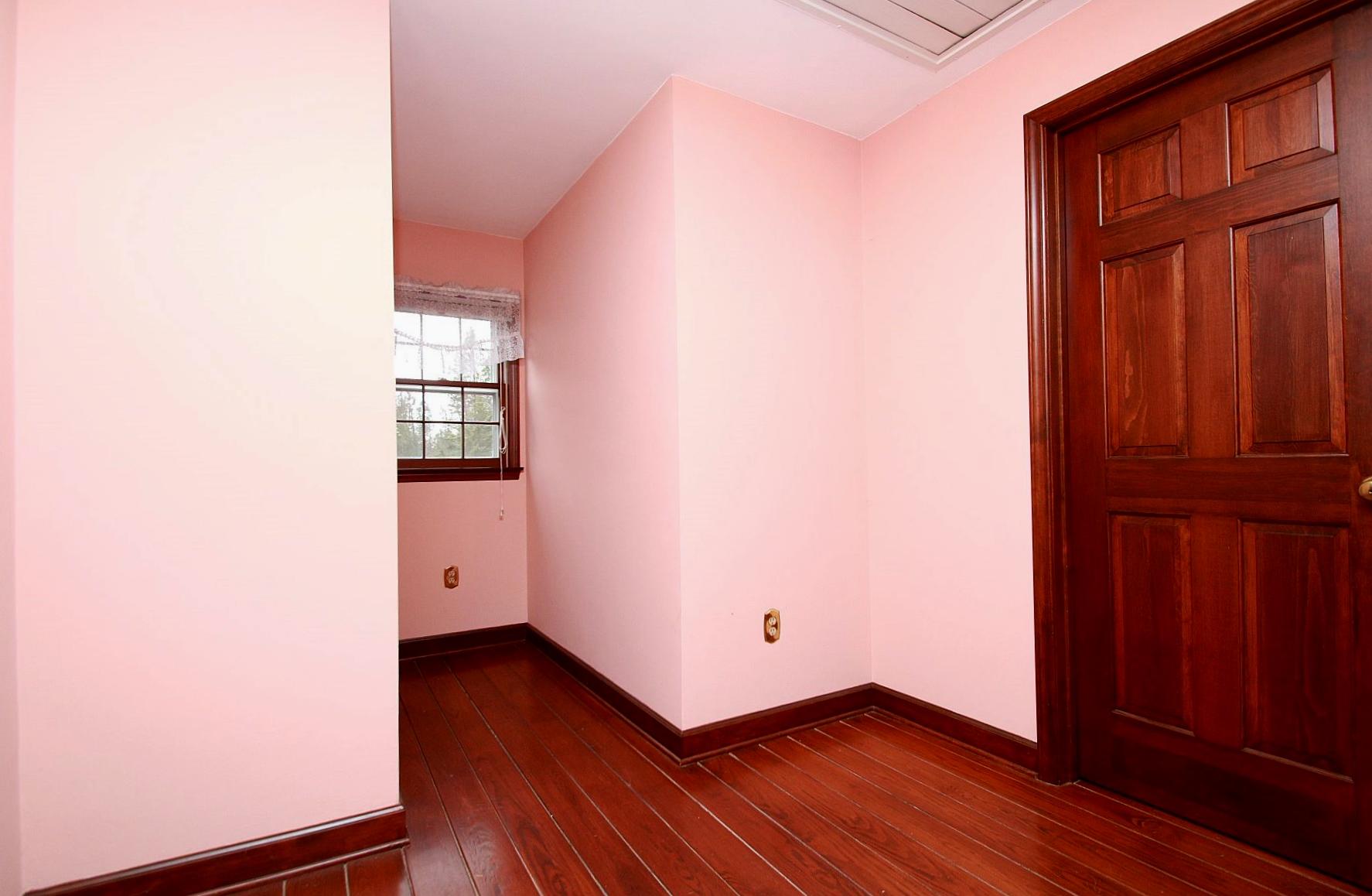 392 Morgans Fork Road Penhook, VA 24137 - Photo 20 of 56 a view of an empty room with wooden floor and a window