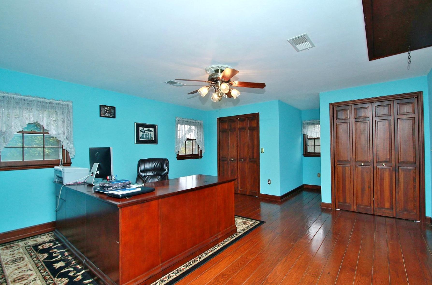 392 Morgans Fork Road Penhook, VA 24137 - Photo 22 of 56 a room with wooden floor and furniture