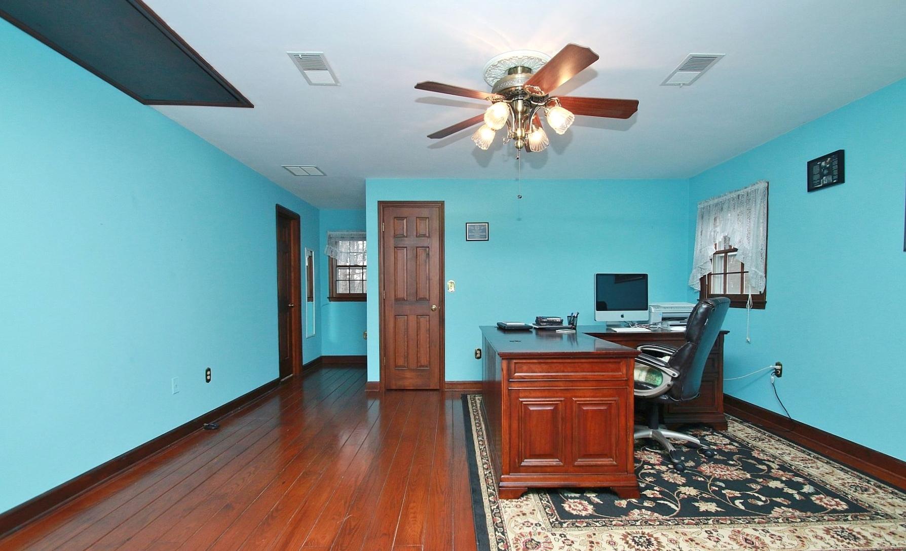 392 Morgans Fork Road Penhook, VA 24137 - Photo 23 of 56 a view of a workspace with furniture and wooden floor