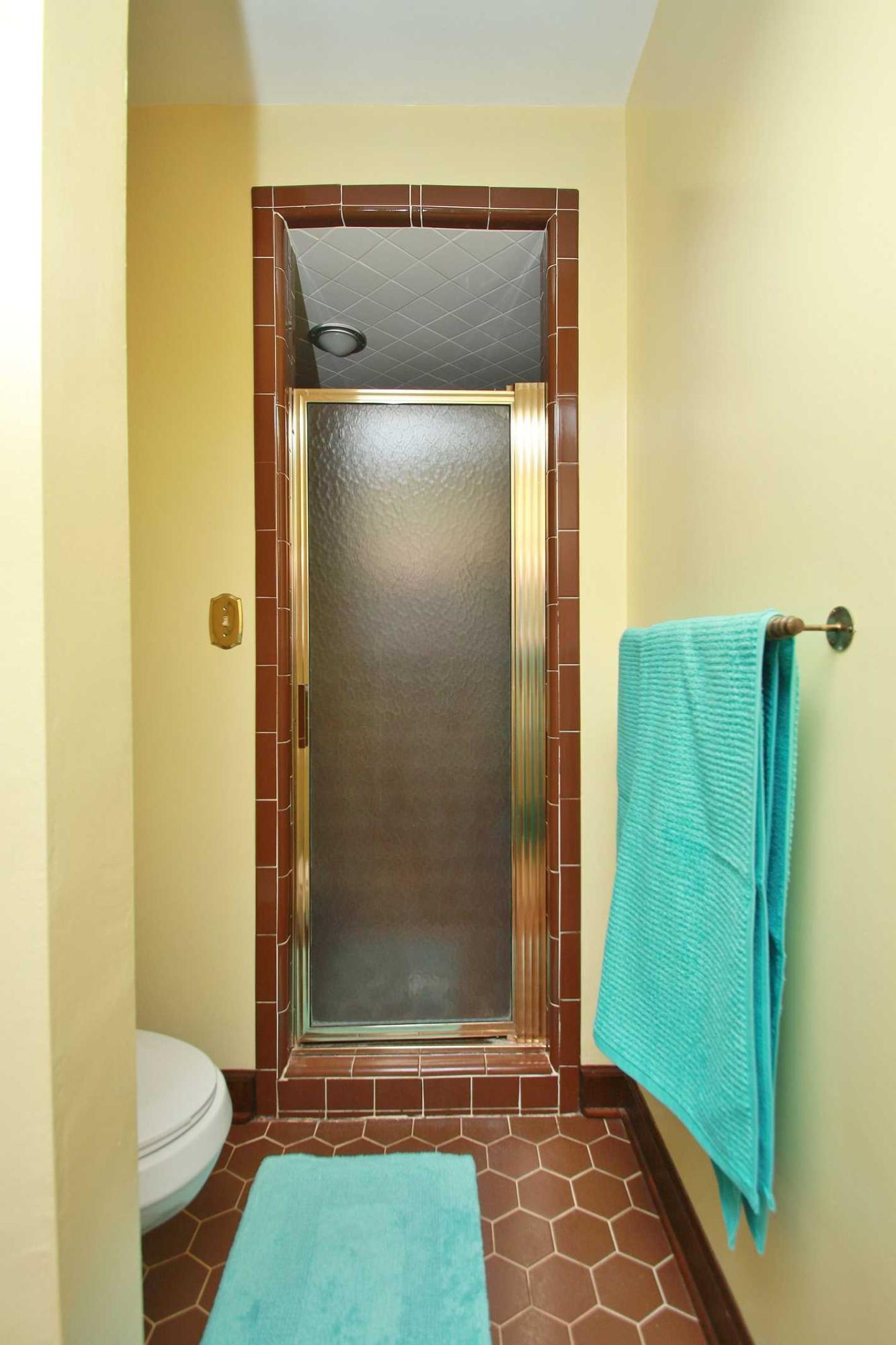 392 Morgans Fork Road Penhook, VA 24137 - Photo 25 of 56 a bathroom with a granite countertop shower and a toilet