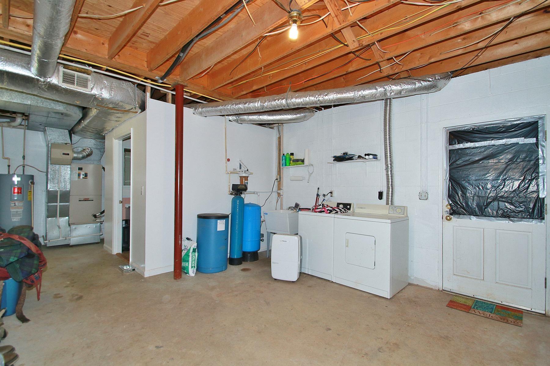 392 Morgans Fork Road Penhook, VA 24137 - Photo 30 of 56 a utility room with dryer and washer