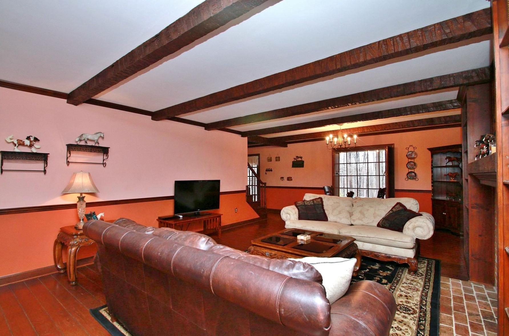 392 Morgans Fork Road Penhook, VA 24137 - Photo 4 of 56 a living room with furniture and a flat screen tv