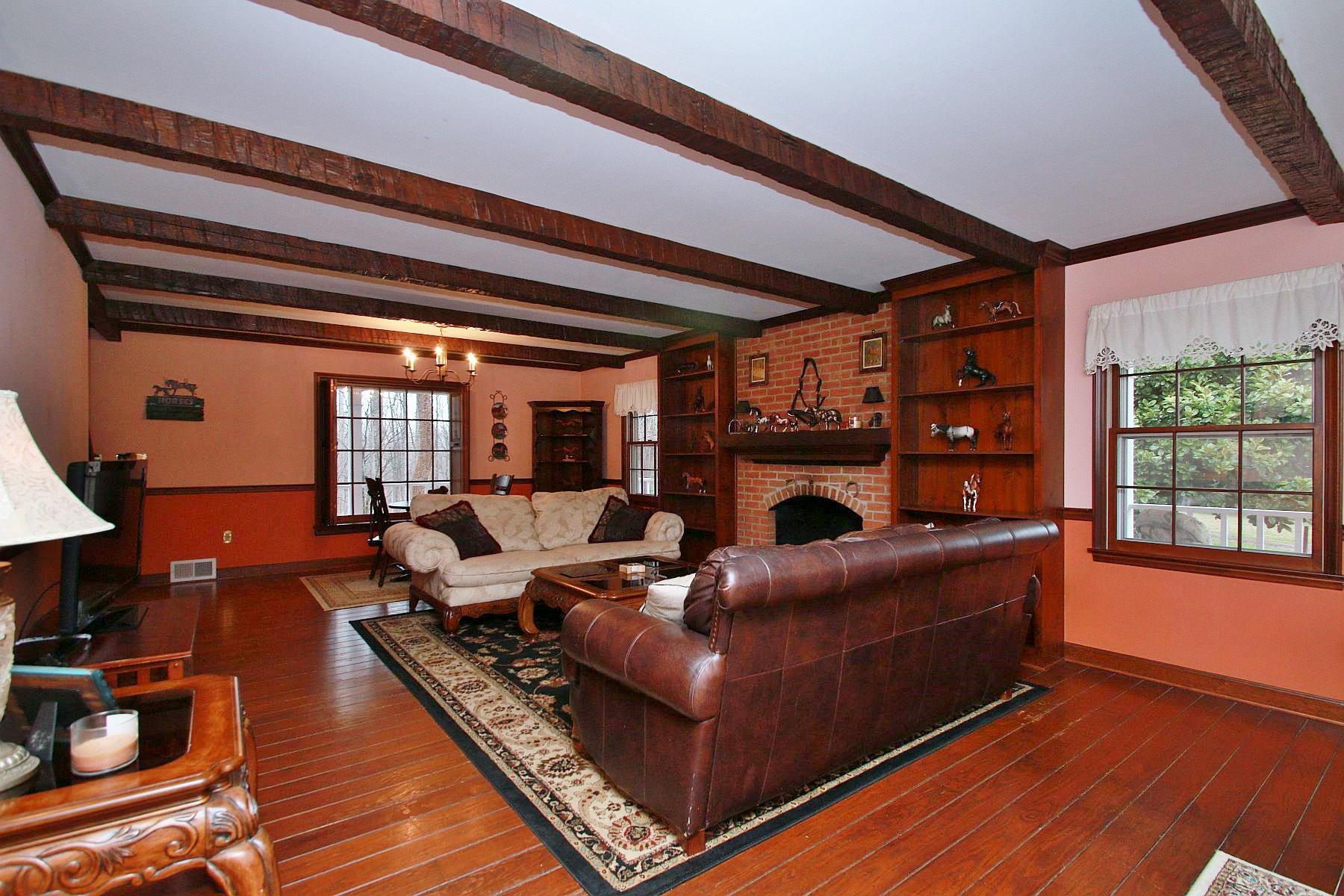 392 Morgans Fork Road Penhook, VA 24137 - Photo 38 of 56 a living room with furniture a window and wooden floor