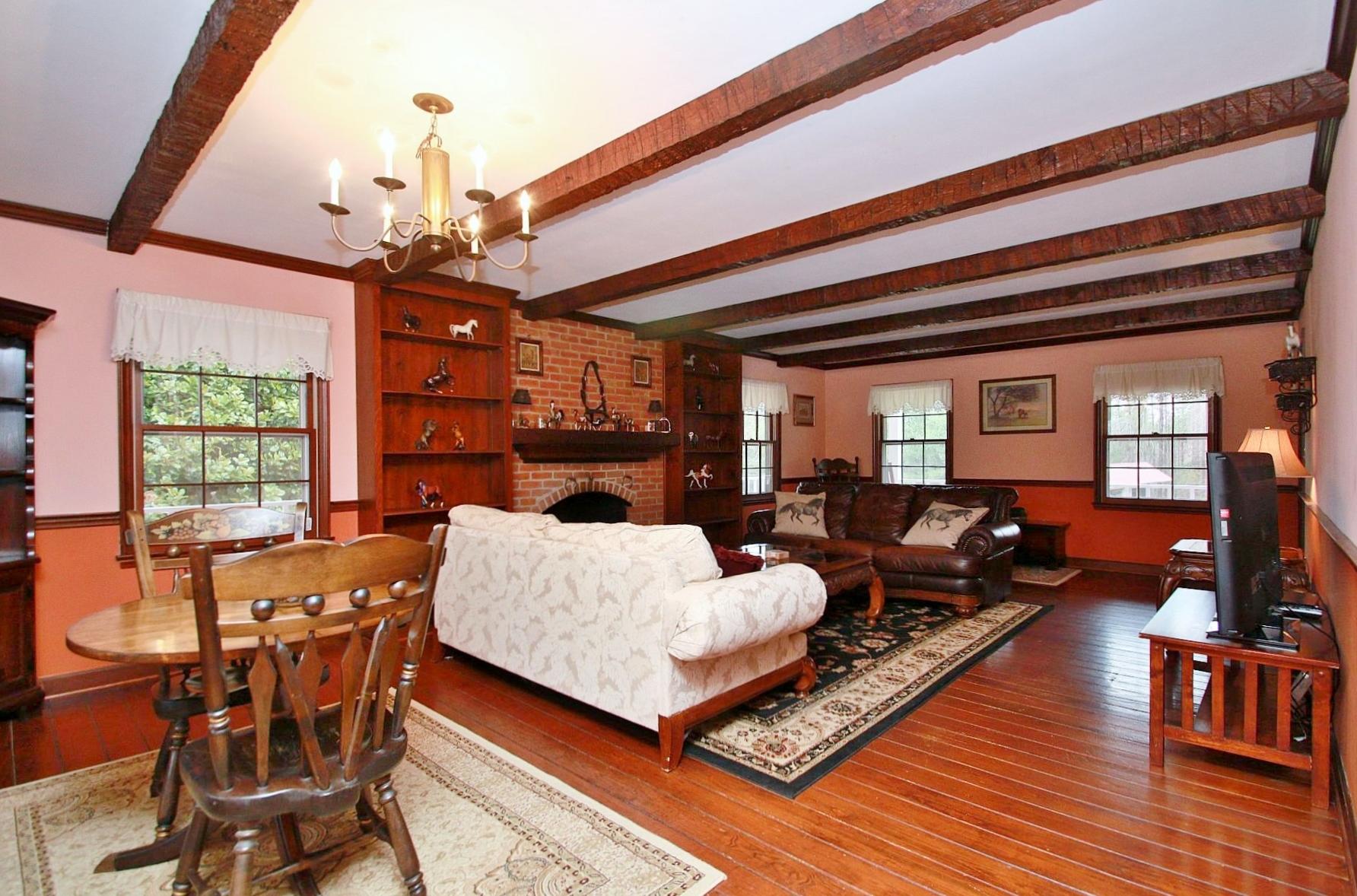 392 Morgans Fork Road Penhook, VA 24137 - Photo 39 of 56 a living room with fireplace furniture and a wooden floor