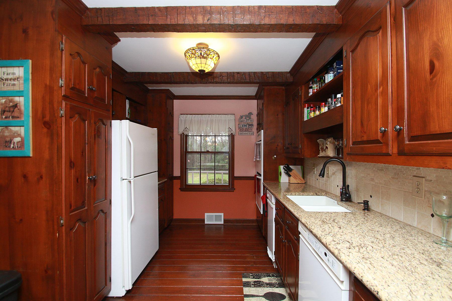 392 Morgans Fork Road Penhook, VA 24137 - Photo 42 of 56 a kitchen with a refrigerator and a sink
