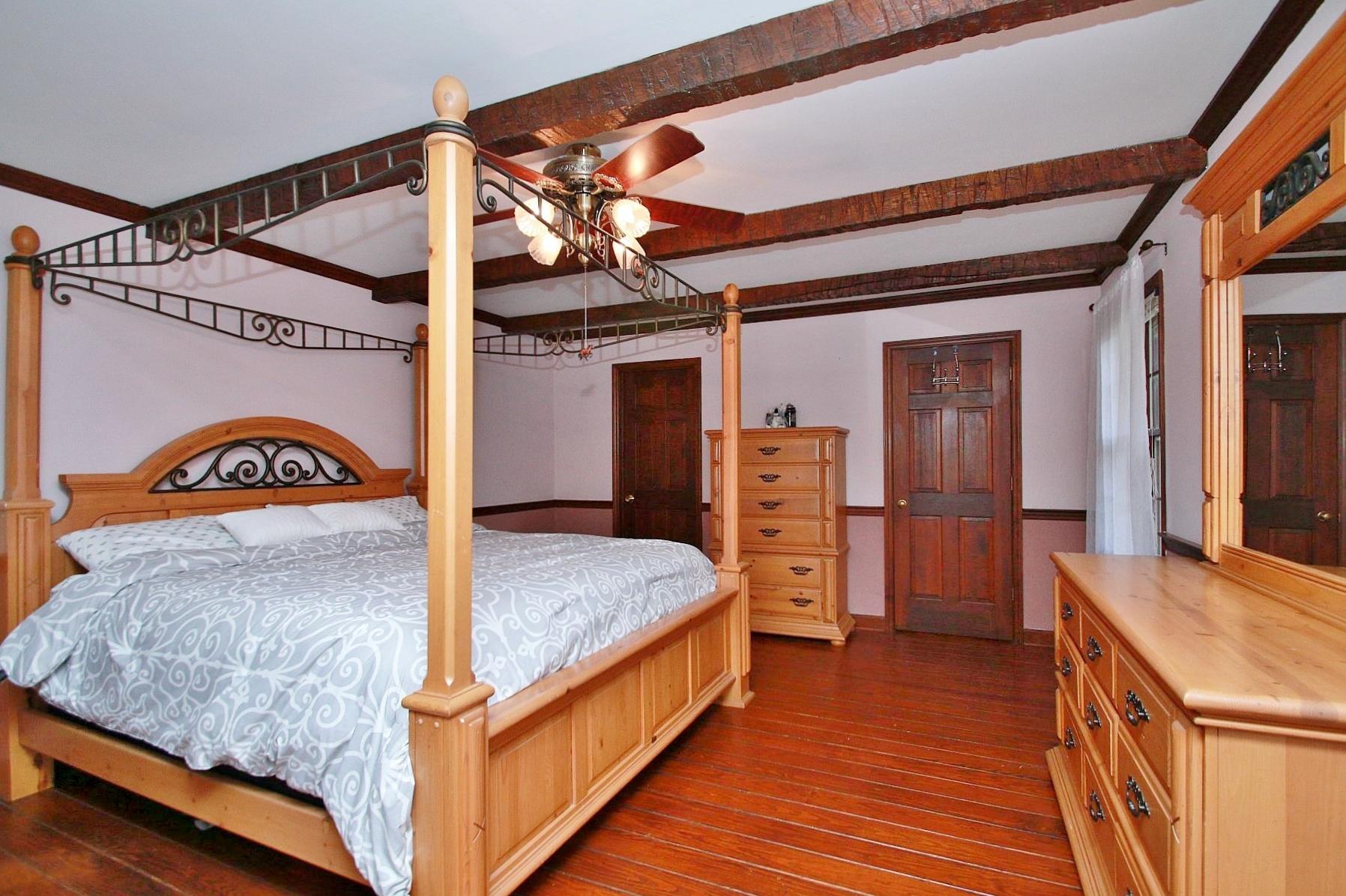 392 Morgans Fork Road Penhook, VA 24137 - Photo 45 of 56 a bedroom with a bed and a dresser