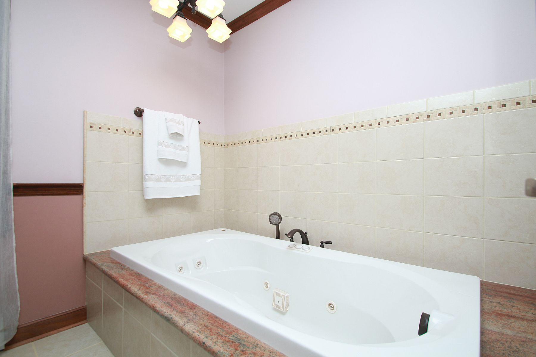 392 Morgans Fork Road Penhook, VA 24137 - Photo 48 of 56 a bathroom with a tub and a shower