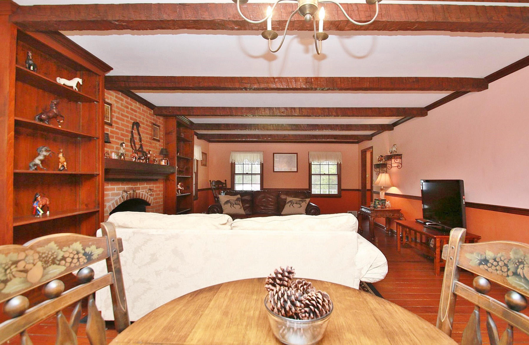 392 Morgans Fork Road Penhook, VA 24137 - Photo 6 of 56 a large bedroom with a bed and wooden floor
