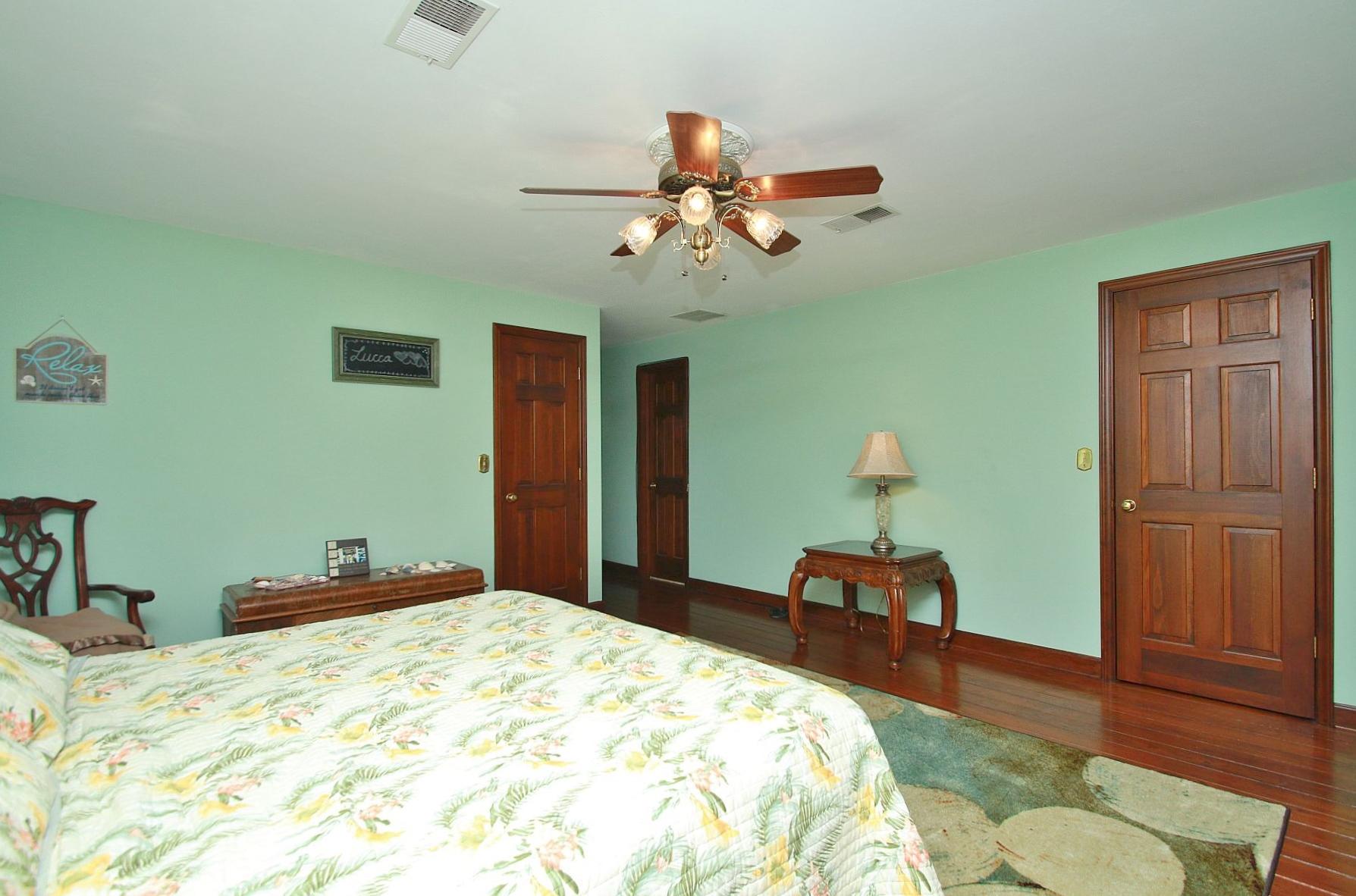 392 Morgans Fork Road Penhook, VA 24137 - Photo 51 of 56 a bedroom with a bed and wooden floor