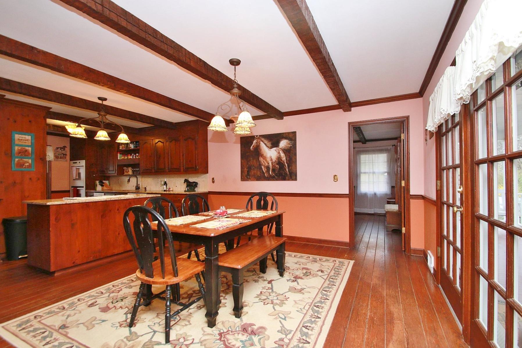 392 Morgans Fork Road Penhook, VA 24137 - Photo 8 of 56 a dining room with a table and chairs
