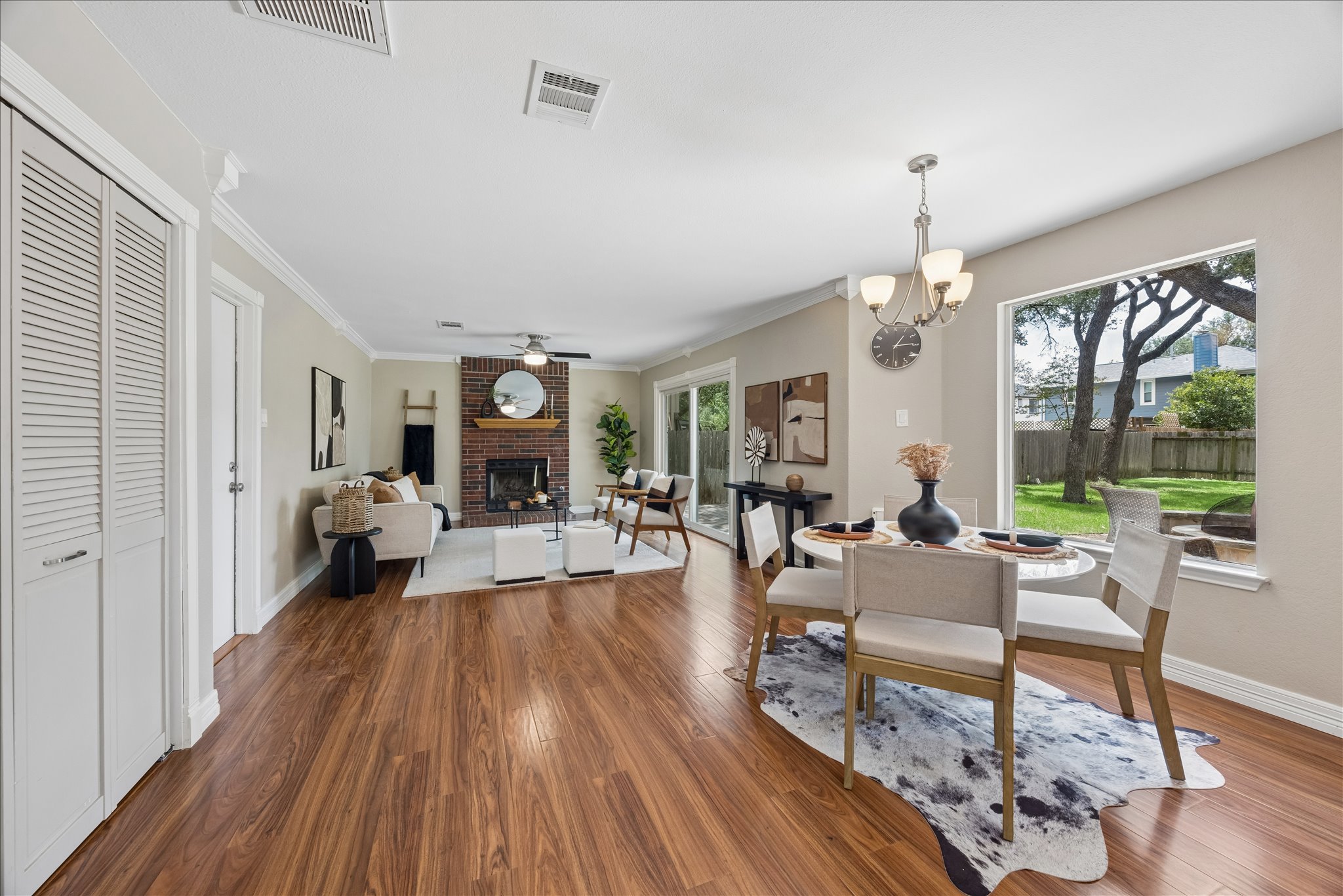 1306 Shady Grove Path Cedar Park, TX 78613 - Photo 9 of 40 a living room with furniture and a chandelier