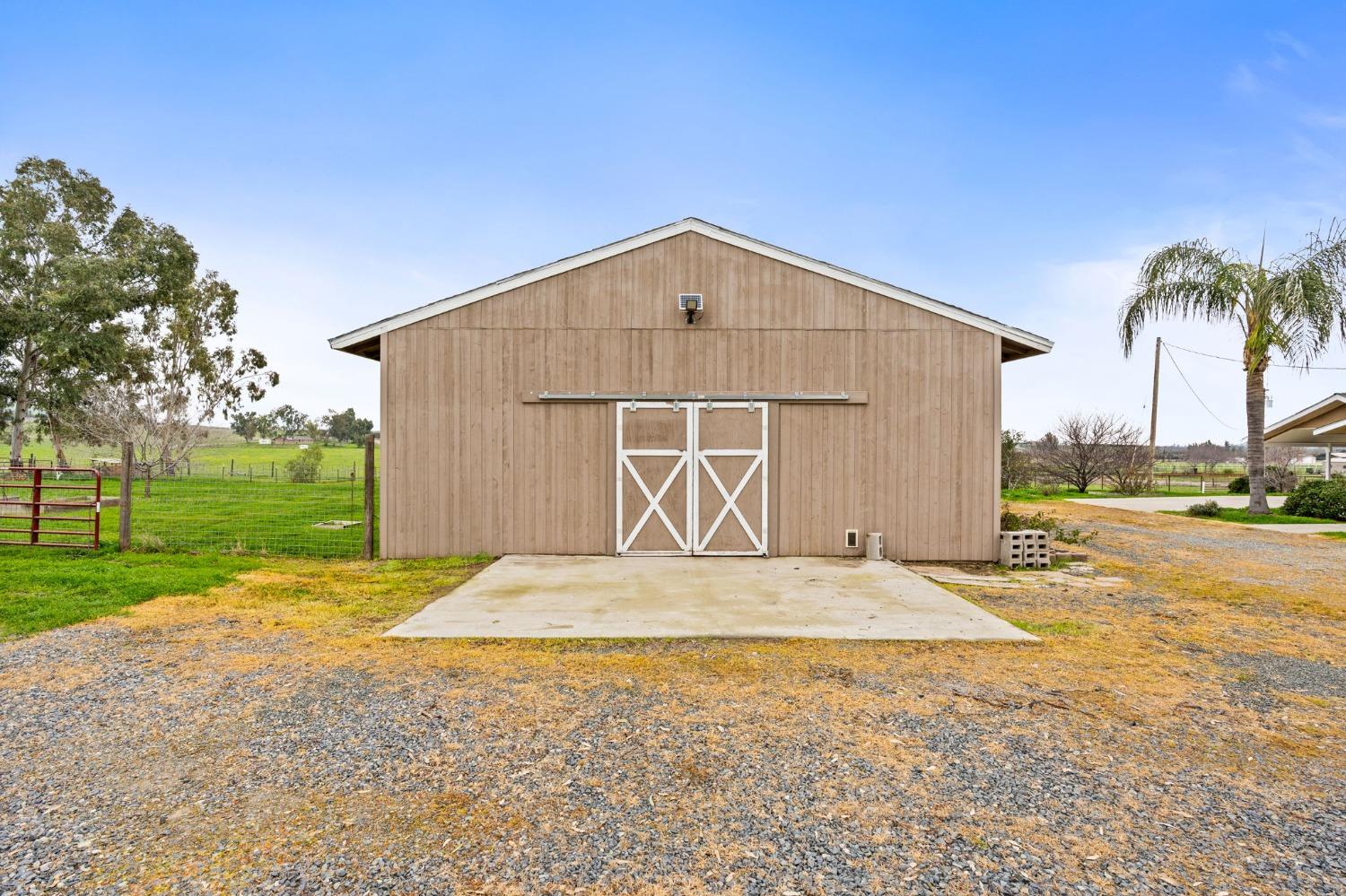 10580 Old Stage Road Porterville, CA 93257 - Photo 33 of 73 a front view of a house with a yard and garage