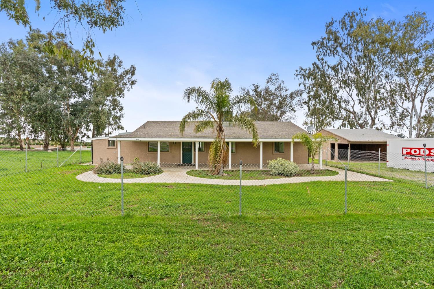 10580 Old Stage Road Porterville, CA 93257 - Photo 42 of 73 a front view of a house with a garden