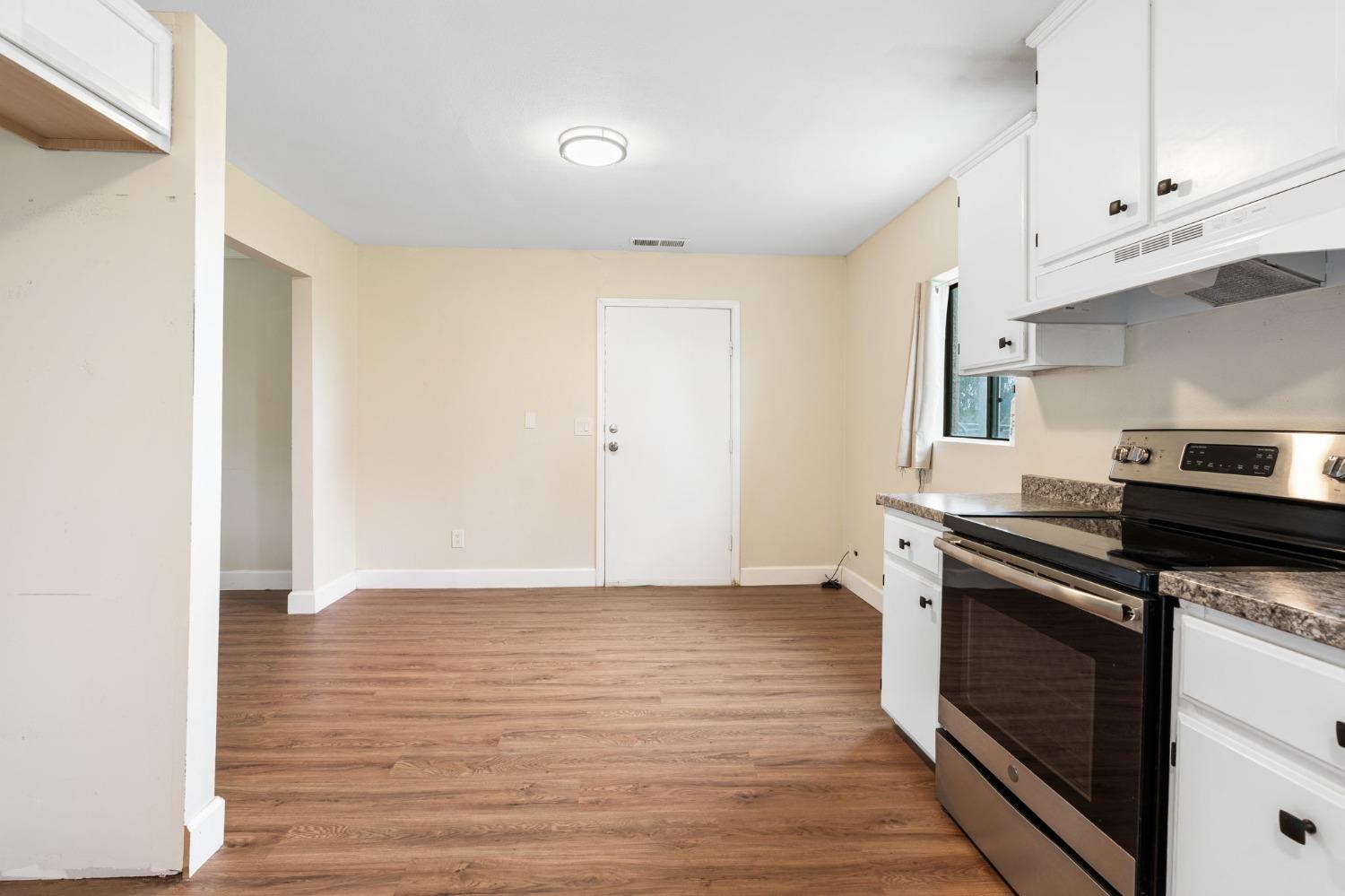 10580 Old Stage Road Porterville, CA 93257 - Photo 53 of 73 a kitchen with granite countertop a stove and a sink