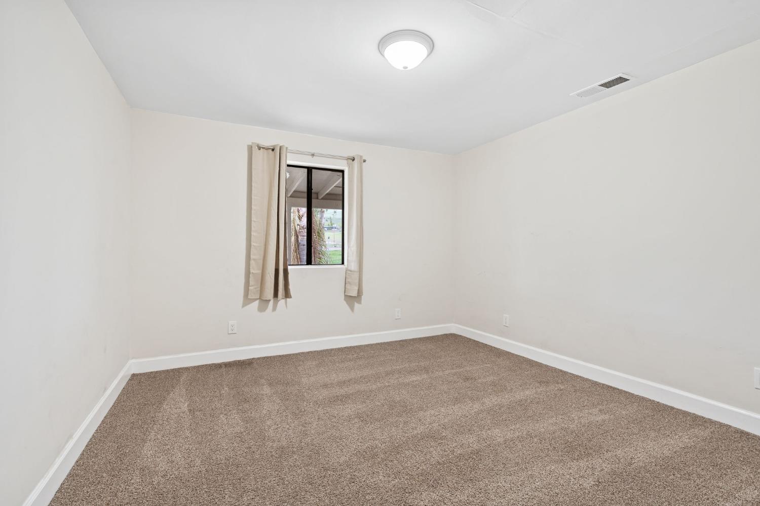 10580 Old Stage Road Porterville, CA 93257 - Photo 57 of 73 an empty room with a window
