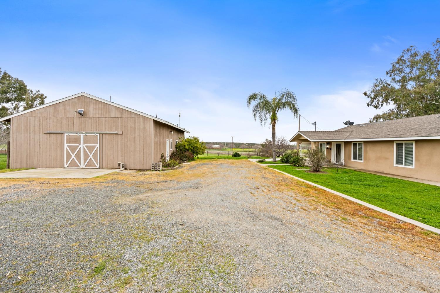 10580 Old Stage Road Porterville, CA 93257 - Photo 8 of 73 a front view of a house with a yard and garage