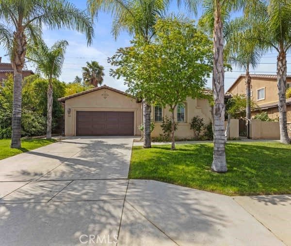 341 Caldera Street Perris, CA 92570 - Photo 18 of 53 a front view of a house with garden