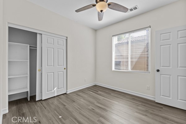 341 Caldera Street Perris, CA 92570 - Photo 25 of 53 a view of an empty room with a window and wooden floor