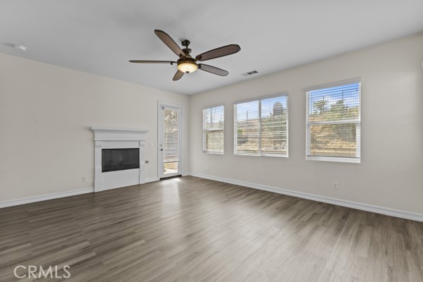 341 Caldera Street Perris, CA 92570 - Photo 26 of 53 a view of an empty room with wooden floor and a window