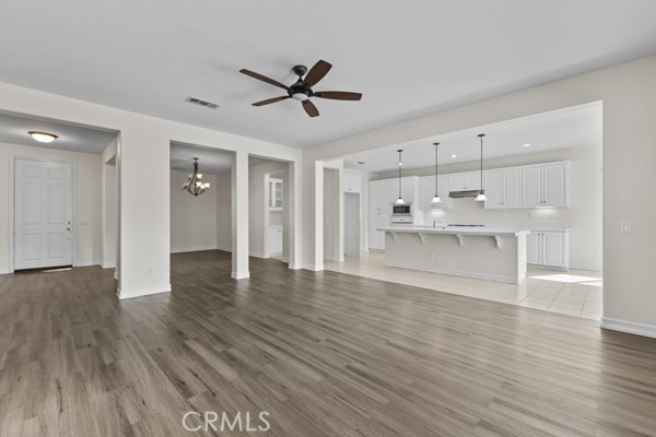 341 Caldera Street Perris, CA 92570 - Photo 40 of 53 a view of a kitchen with wooden floor and a sink