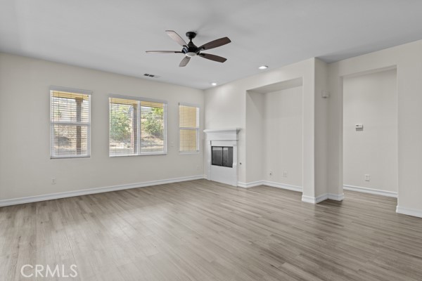 341 Caldera Street Perris, CA 92570 - Photo 46 of 53 a view of an empty room with a window and wooden floor