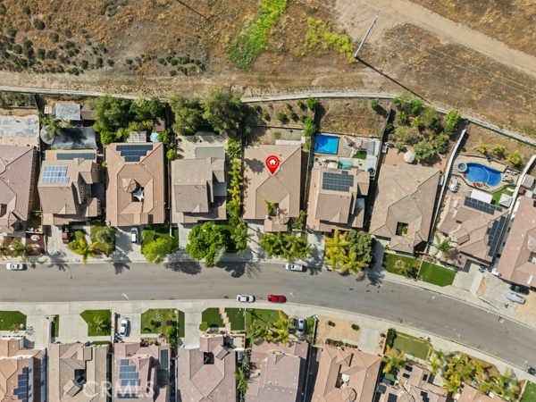 341 Caldera Street Perris, CA 92570 - Photo 6 of 53 an aerial view of multiple houses with a yard