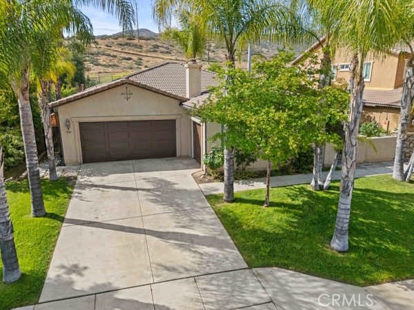 341 Caldera Street Perris, CA 92570 - Photo 7 of 53 a front view of house with yard
