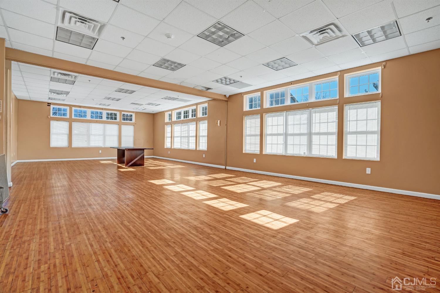 532 Edpas Road New Brunswick, NJ 08901 - Photo 27 of 29 a view of an empty room with wooden floor and a window