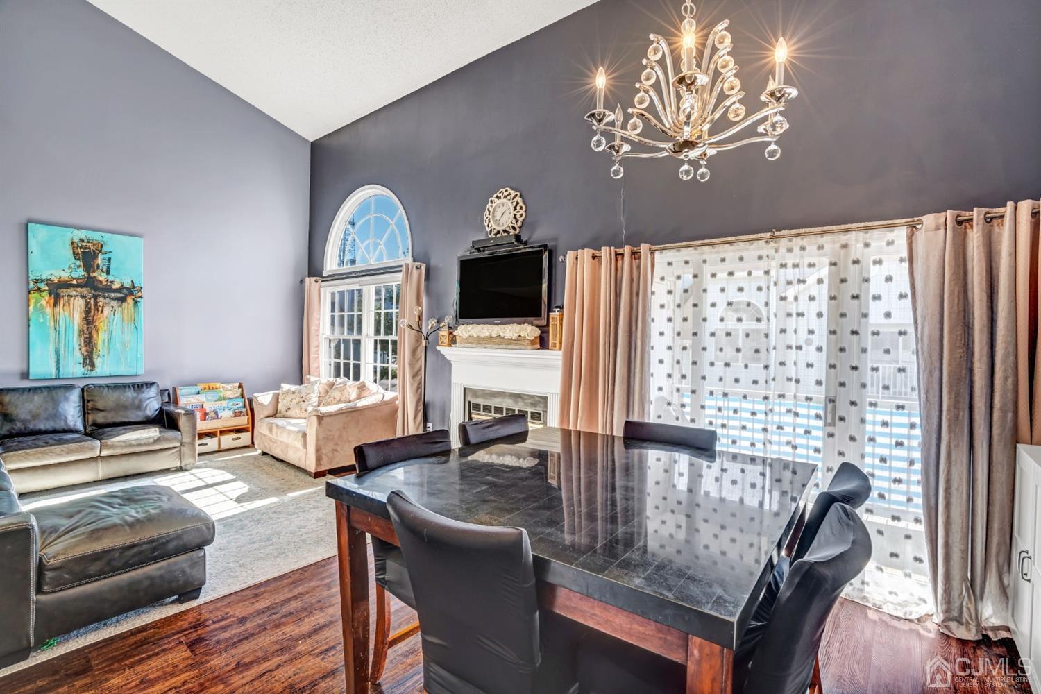 532 Edpas Road New Brunswick, NJ 08901 - Photo 10 of 29 a view of a dining room with furniture a chandelier and wooden floor