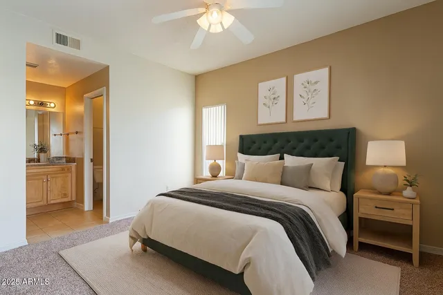 a bedroom with a bed and a dresser