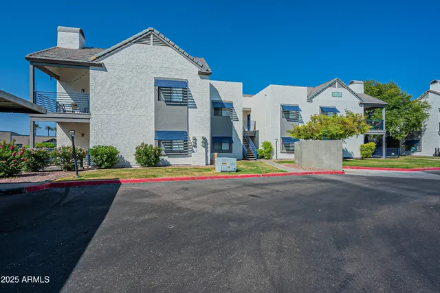 a view of multiple houses with swimming pool