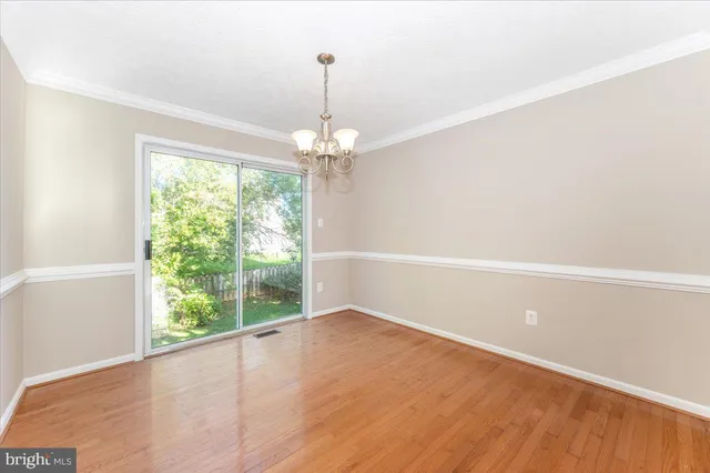 a kitchen with stainless steel appliances granite countertop a refrigerator a stove a sink and a microwave