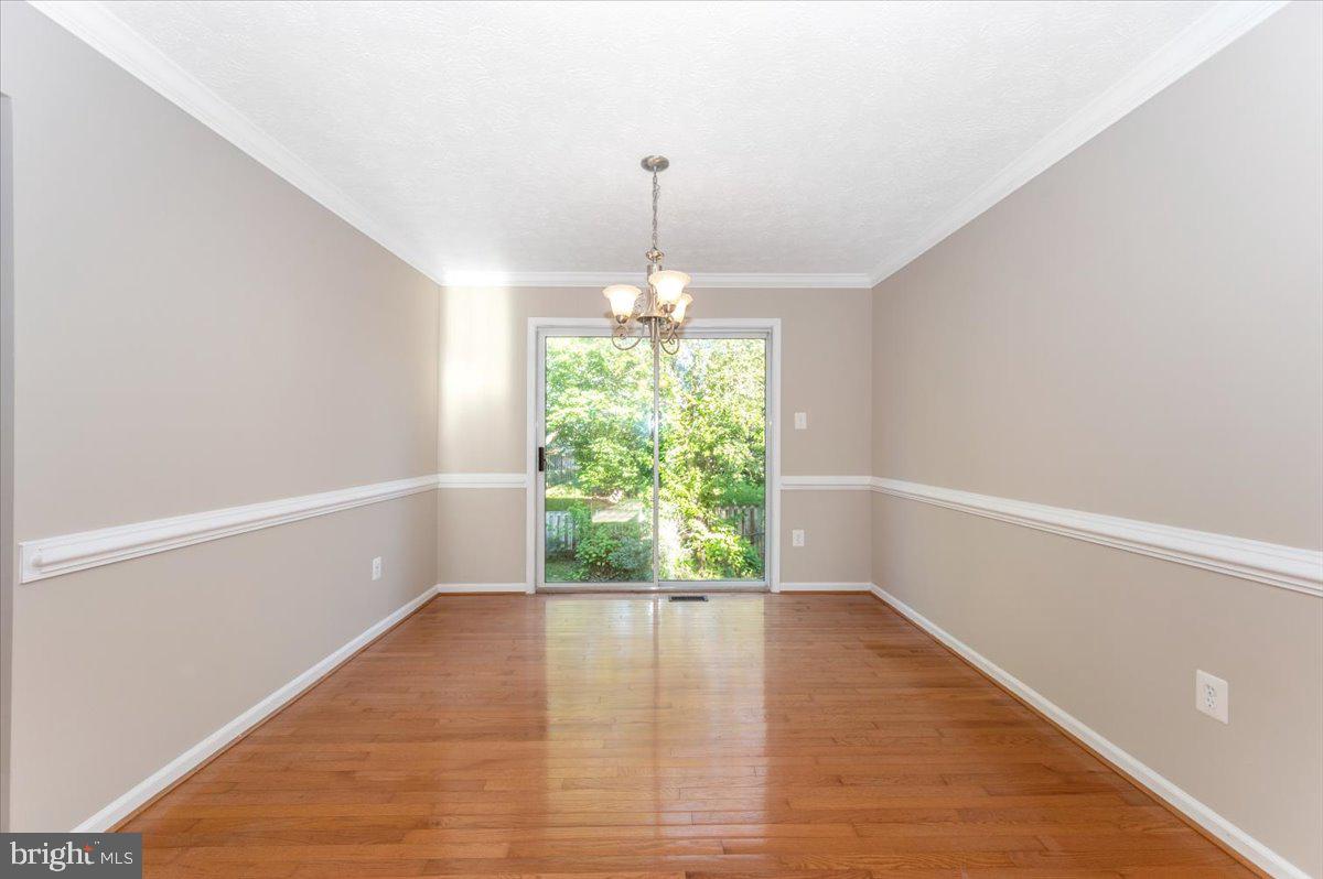 5004 Finch Court Frederick, MD 21703 - Photo 13 of 63 a view of room with window and hardwood floor