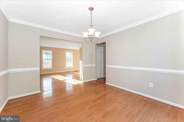 a kitchen with stainless steel appliances a refrigerator and a stove top oven