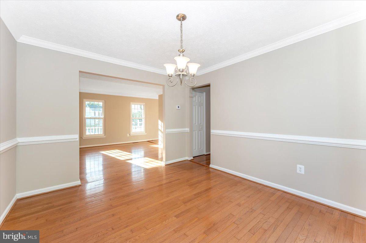5004 Finch Court Frederick, MD 21703 - Photo 14 of 63 wooden floor in an empty room with a window