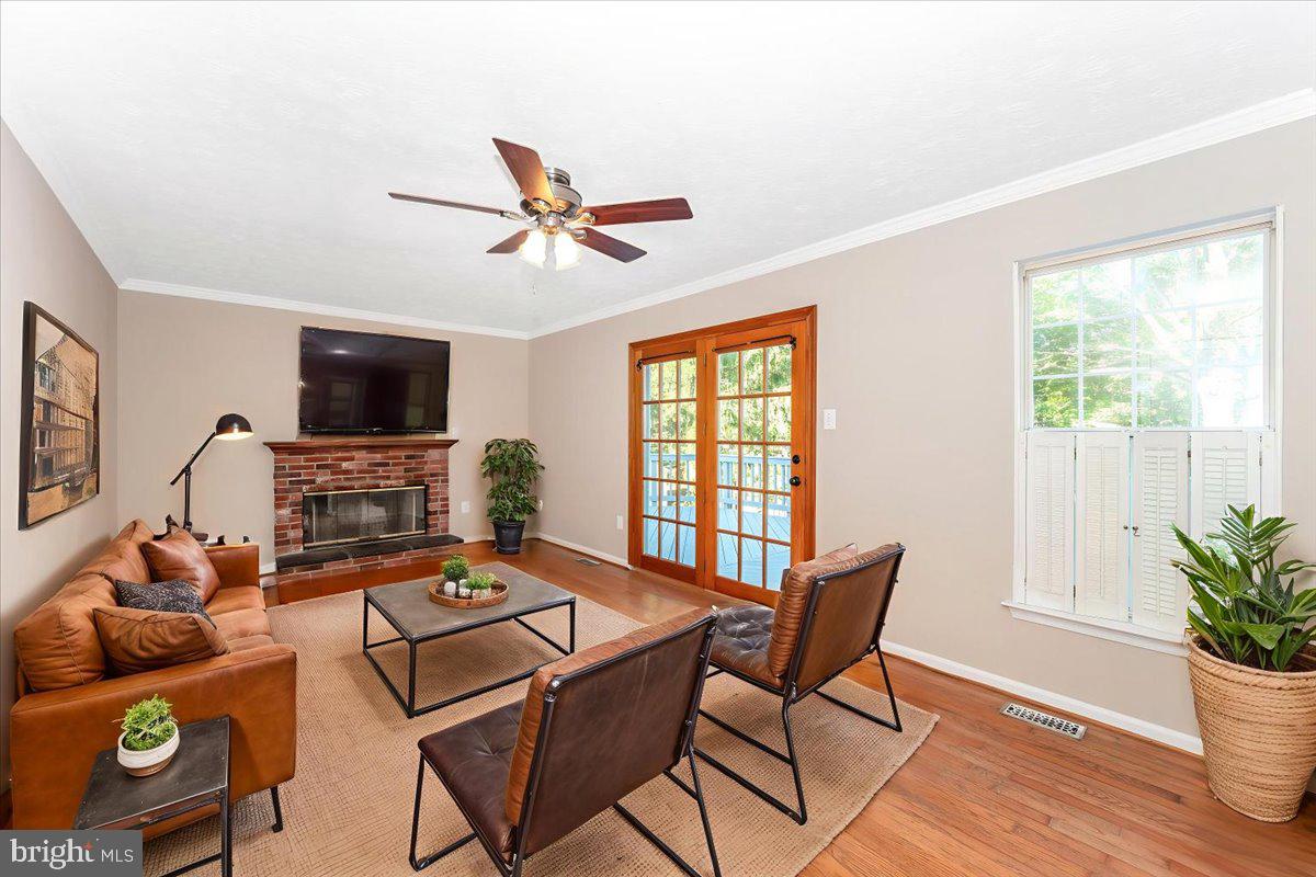 5004 Finch Court Frederick, MD 21703 - Photo 21 of 63 a living room with furniture and a flat screen tv