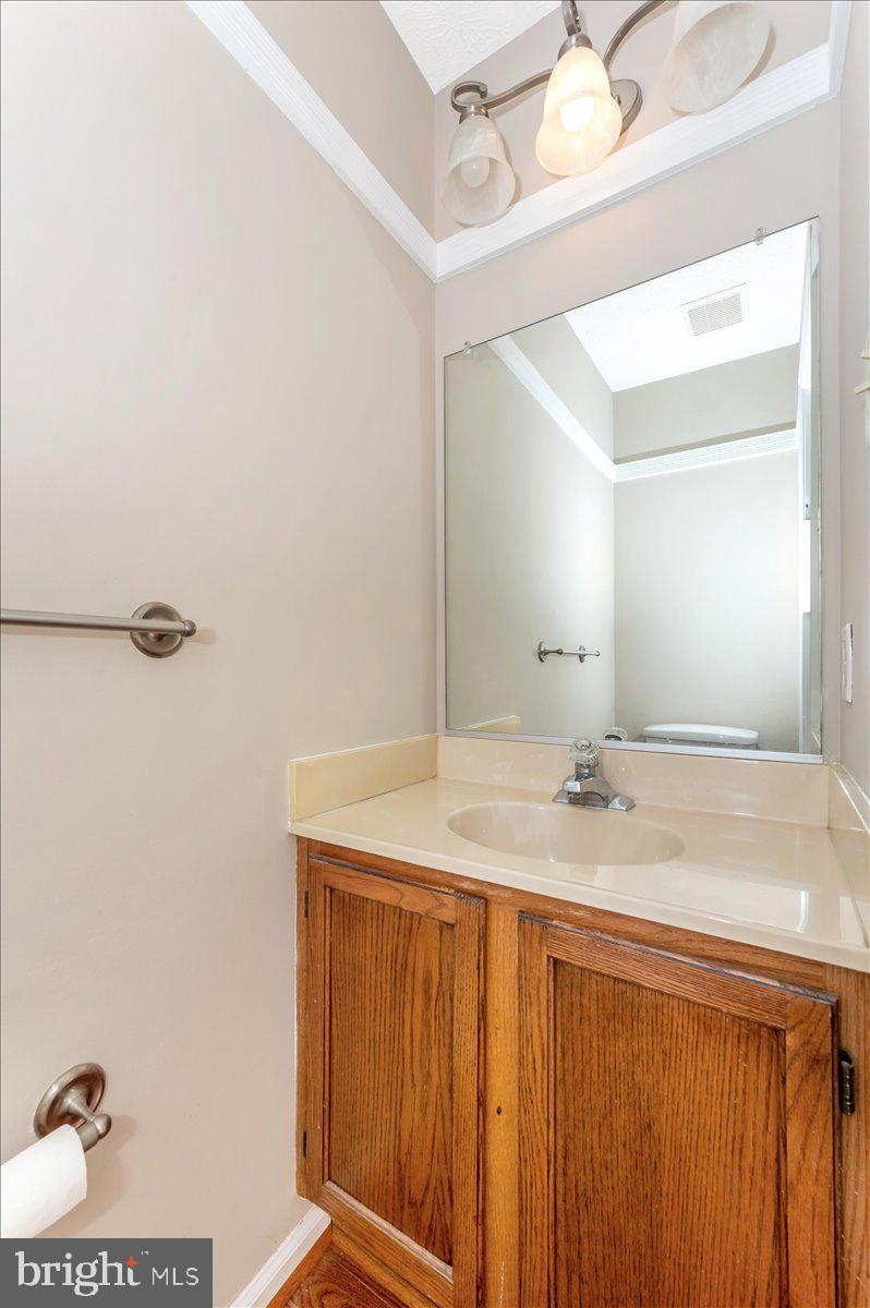 5004 Finch Court Frederick, MD 21703 - Photo 25 of 63 a bathroom with a sink and a mirror