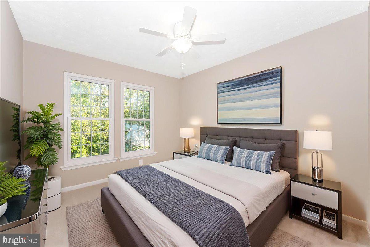 5004 Finch Court Frederick, MD 21703 - Photo 38 of 63 a bedroom with a large bed and a window