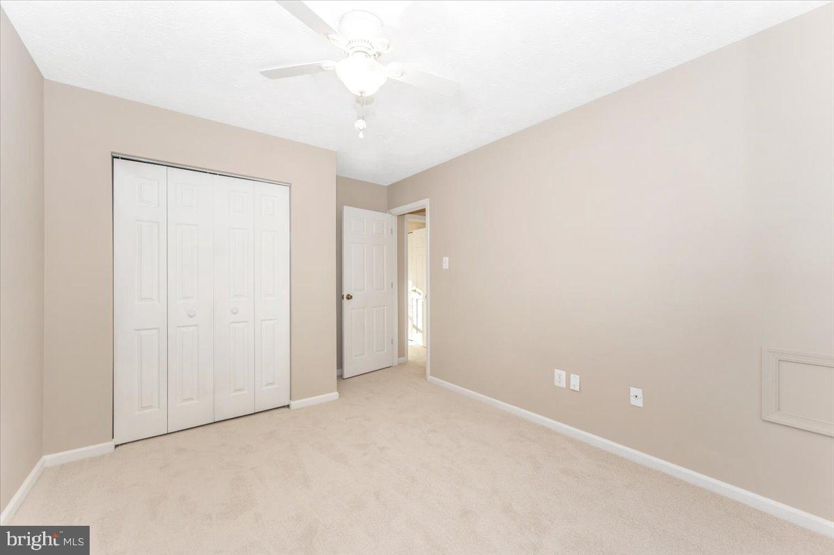 5004 Finch Court Frederick, MD 21703 - Photo 40 of 63 an empty room with a ceiling fan and a window