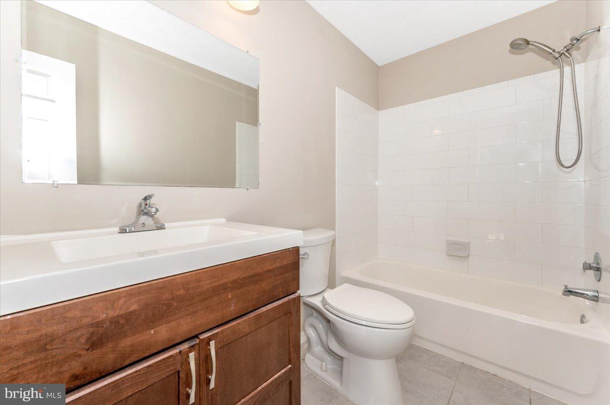 5004 Finch Court Frederick, MD 21703 - Photo 41 of 63 a bathroom with a sink a toilet and a bathtub