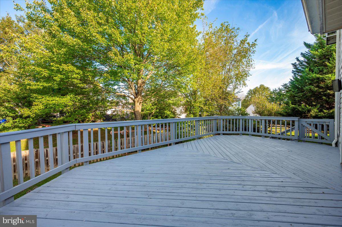 5004 Finch Court Frederick, MD 21703 - Photo 49 of 63 a view of deck with wooden floor and fence