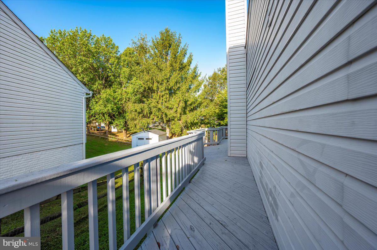 5004 Finch Court Frederick, MD 21703 - Photo 53 of 63 a view of a balcony with wooden floor