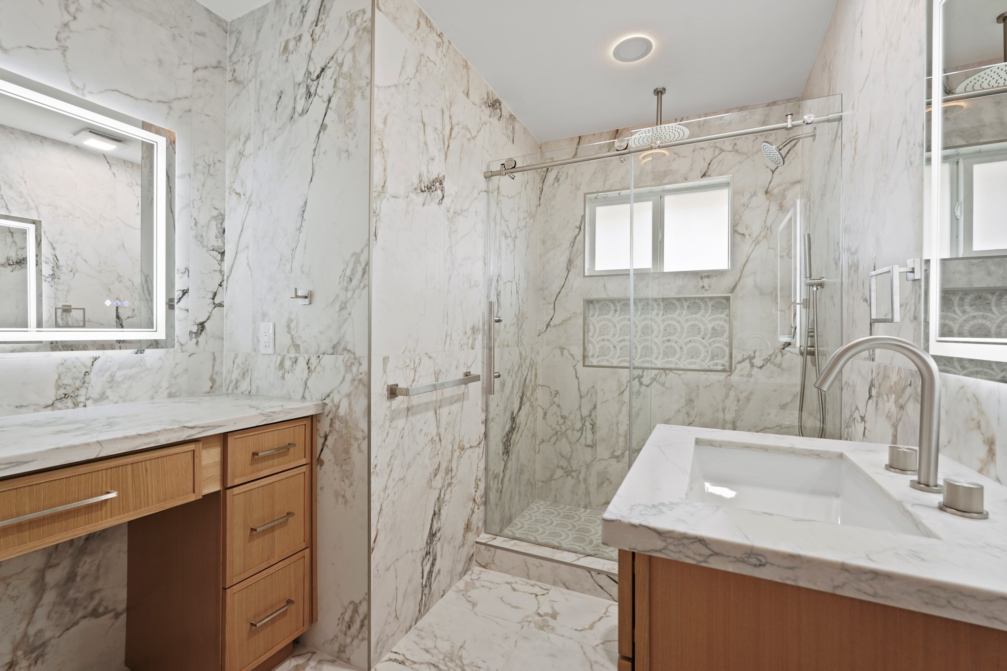 5451 Redstart Street Houston, TX 77096 - Photo 16 of 23 a bathroom with a granite countertop sink a mirror a shower and a bathtub