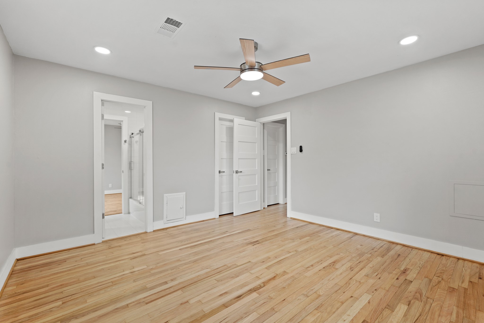5451 Redstart Street Houston, TX 77096 - Photo 18 of 23 a view of an empty room and wooden floor