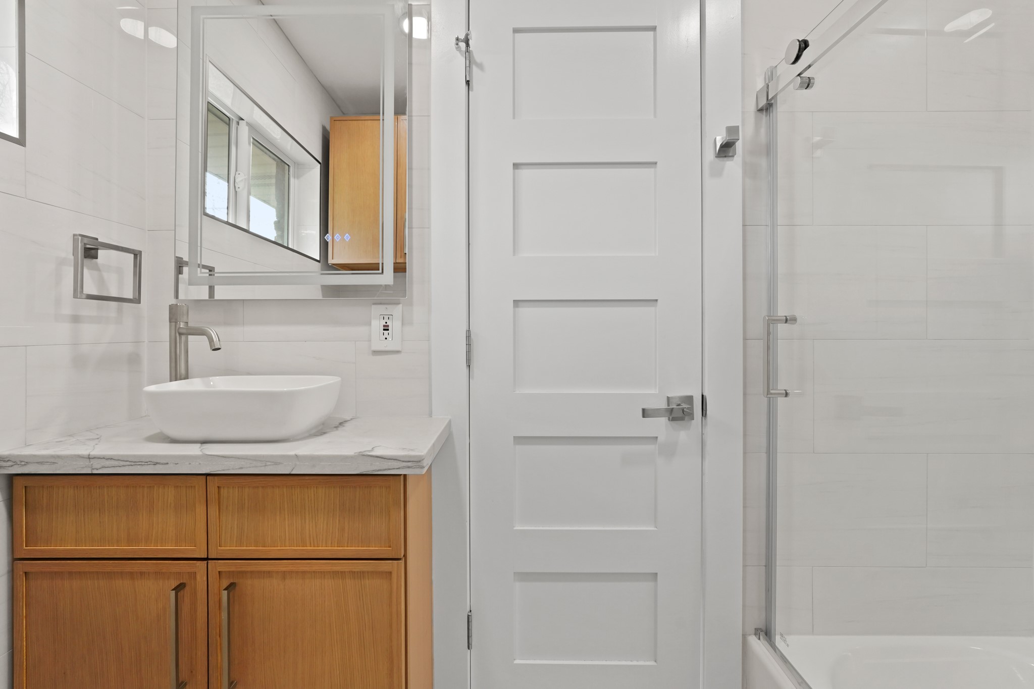 5451 Redstart Street Houston, TX 77096 - Photo 21 of 23 a bathroom with a granite countertop sink and mirror